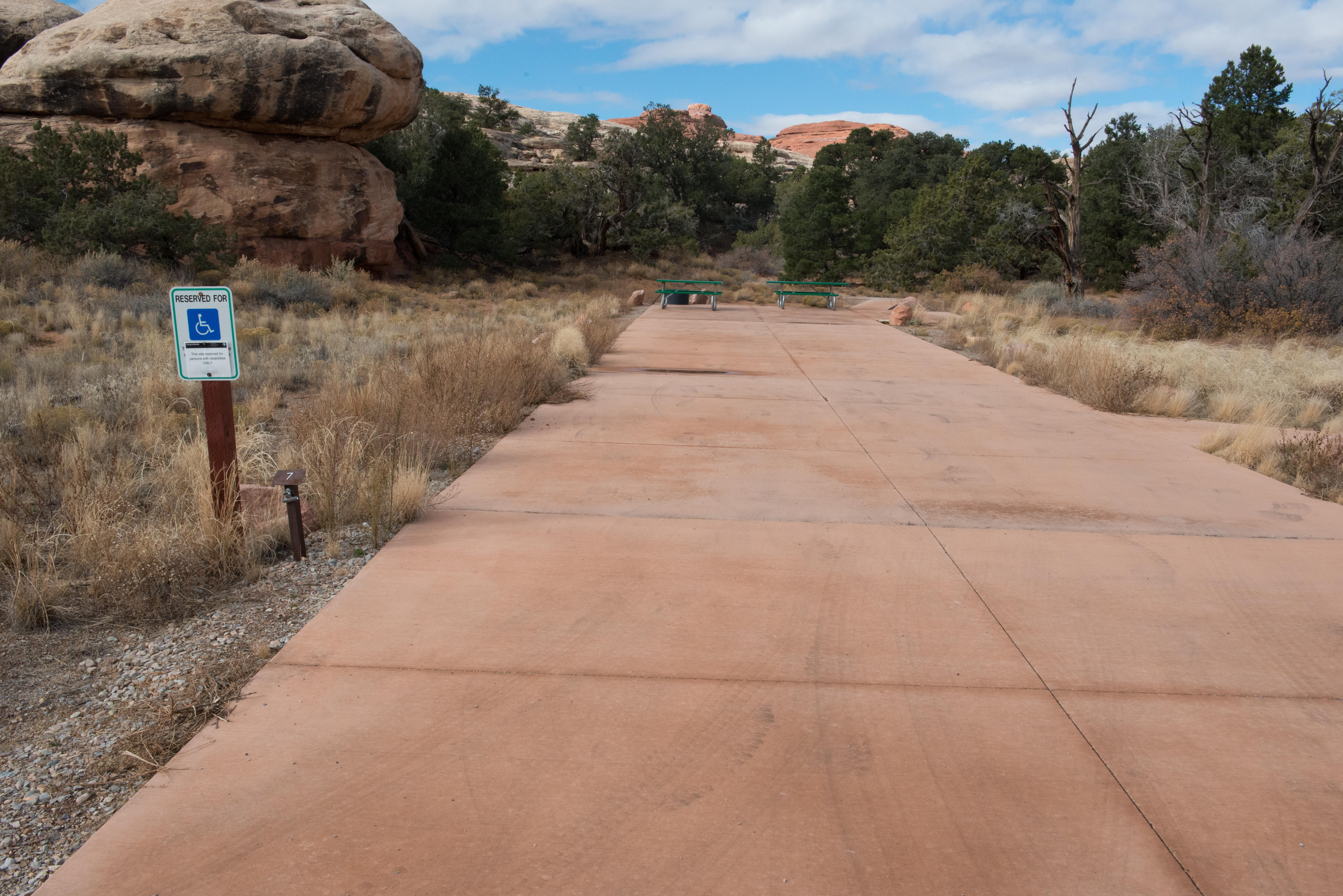 a campsite with a long paved driveway