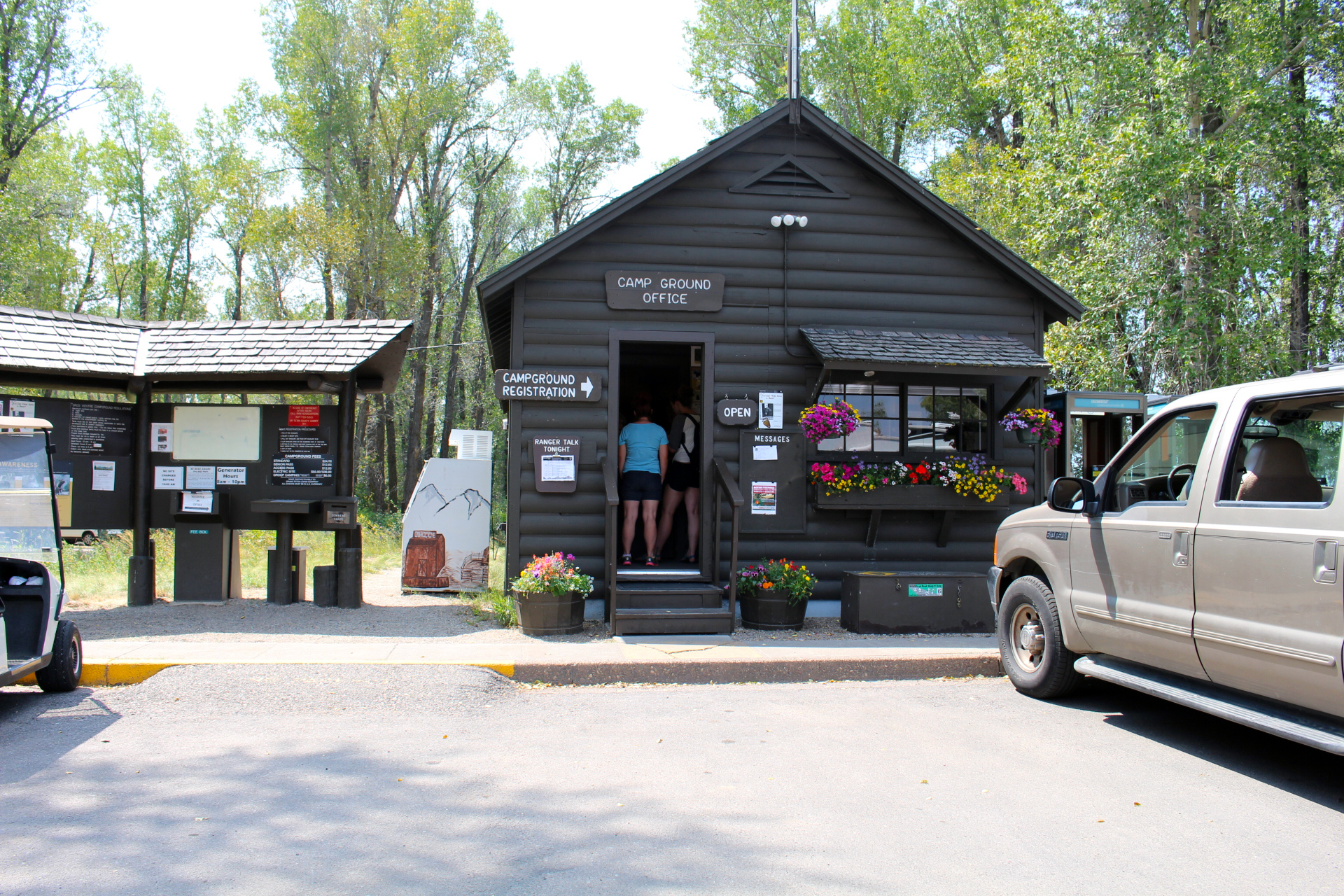 Gros Ventre campground kiosk with information board and visitors checking in.