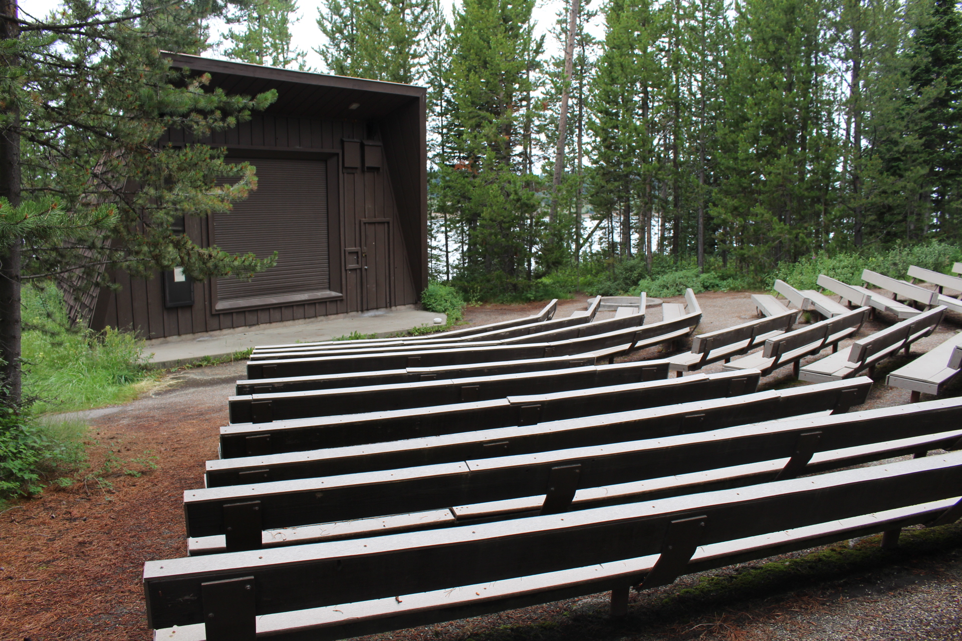 Amphitheater with building and bench seats at campground
