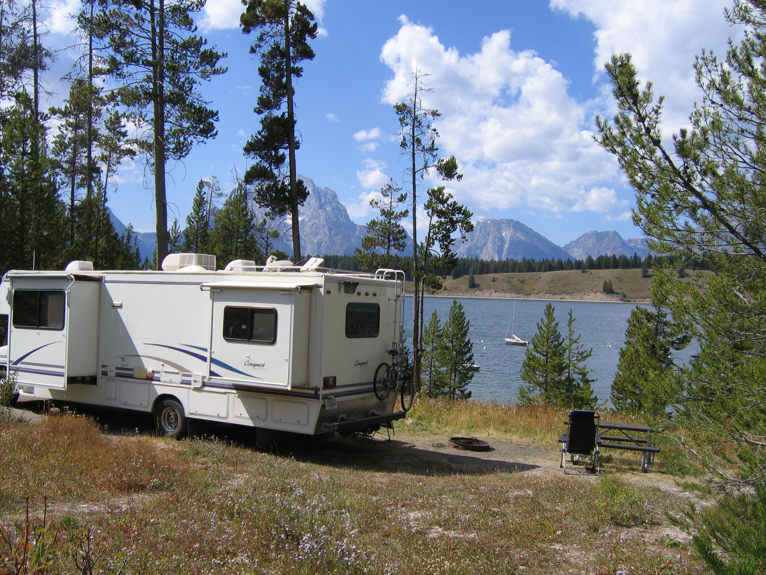 Camper trailer with Jackson Lake and Mount Moran in the distance