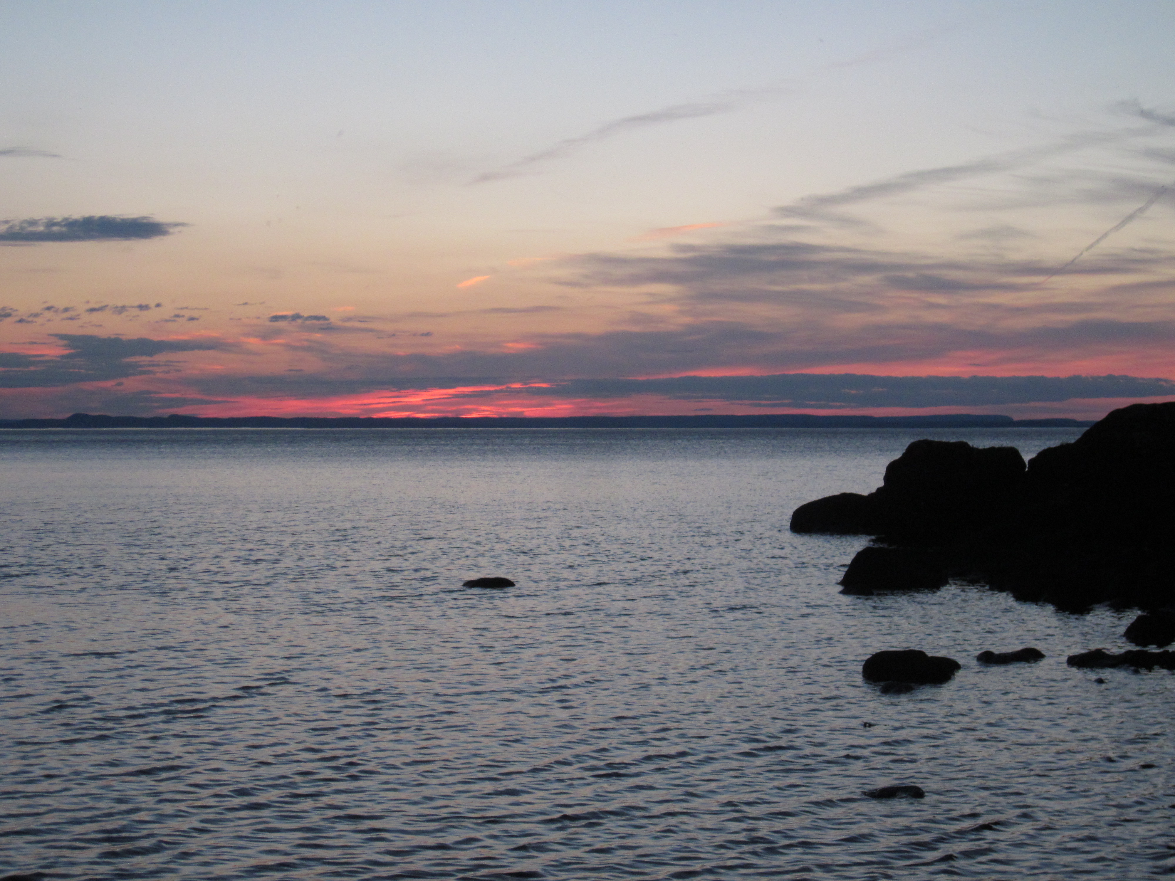 Colorful sunset over Lake Superior at Hugunnin Cove Campground