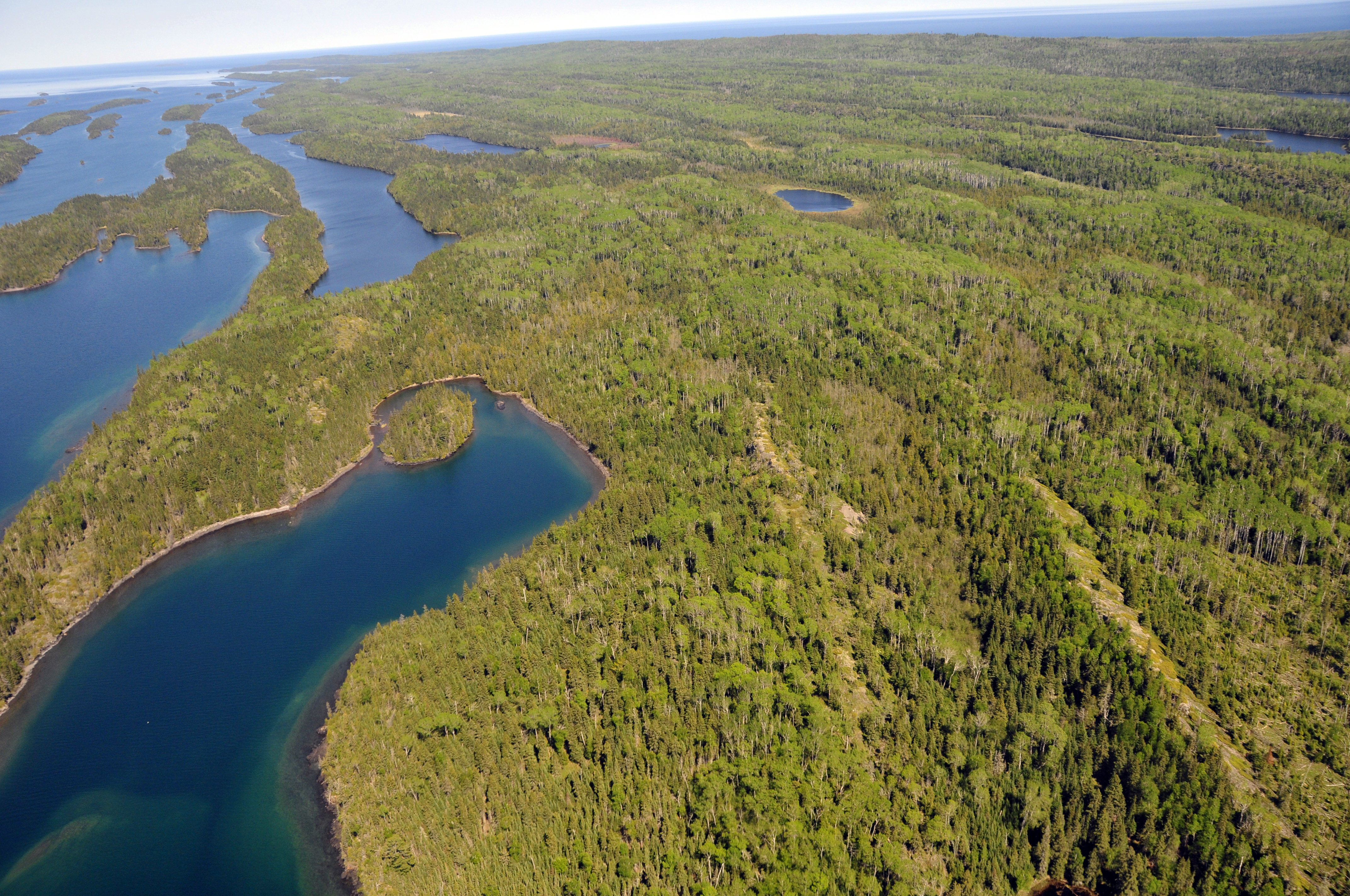 Aerial view of the blue waters of Herring Bay and Pickerel Cove.