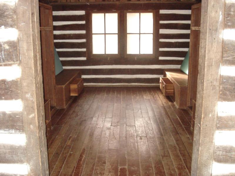 The inside of a cabin shows bunk beds