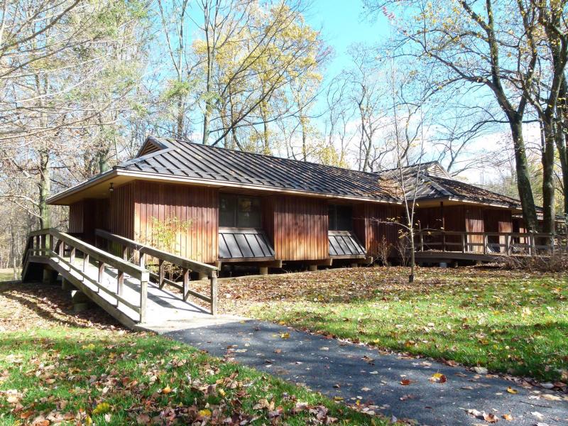 One story brown wooden building with ramp