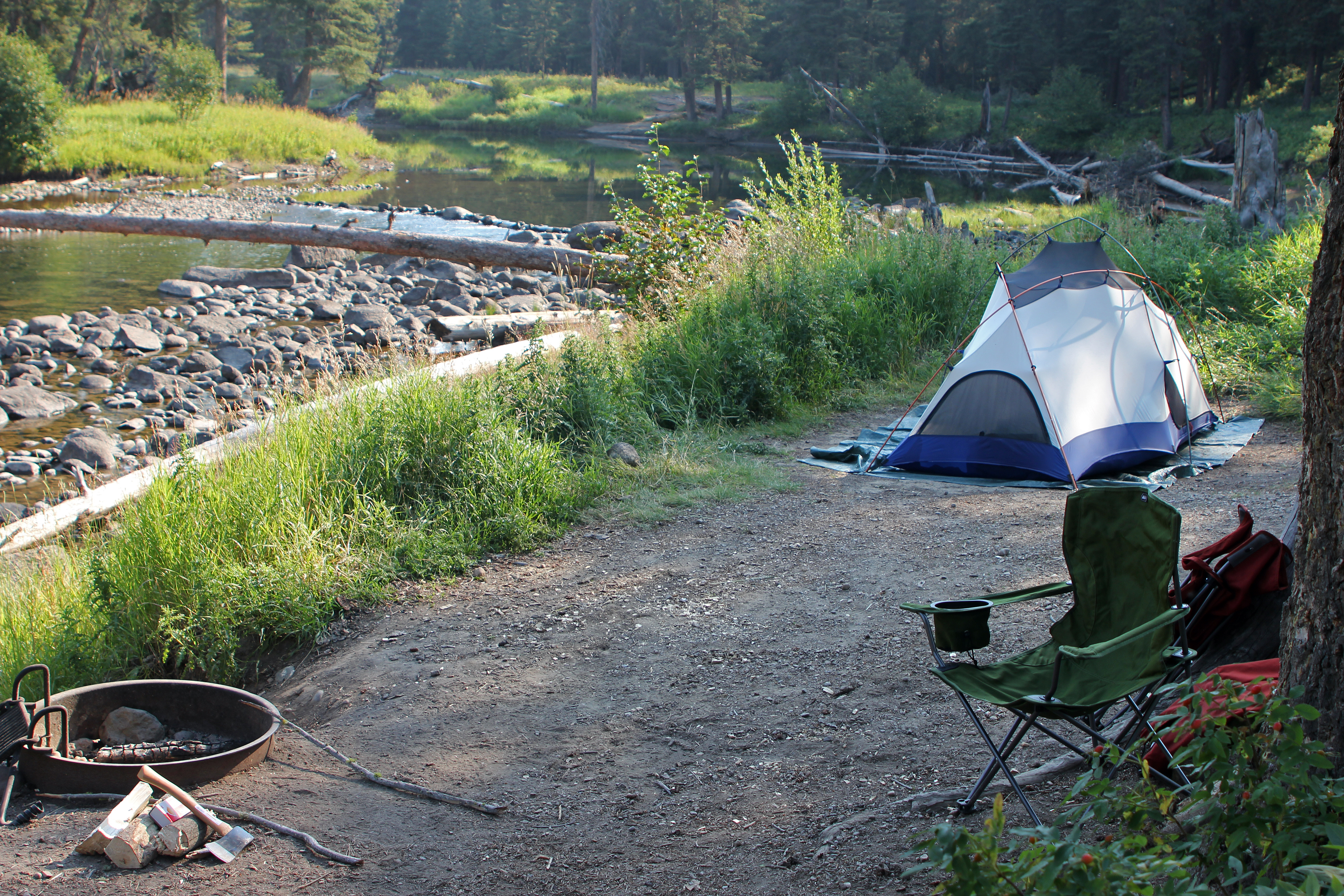 Tent and camp chair at campsite