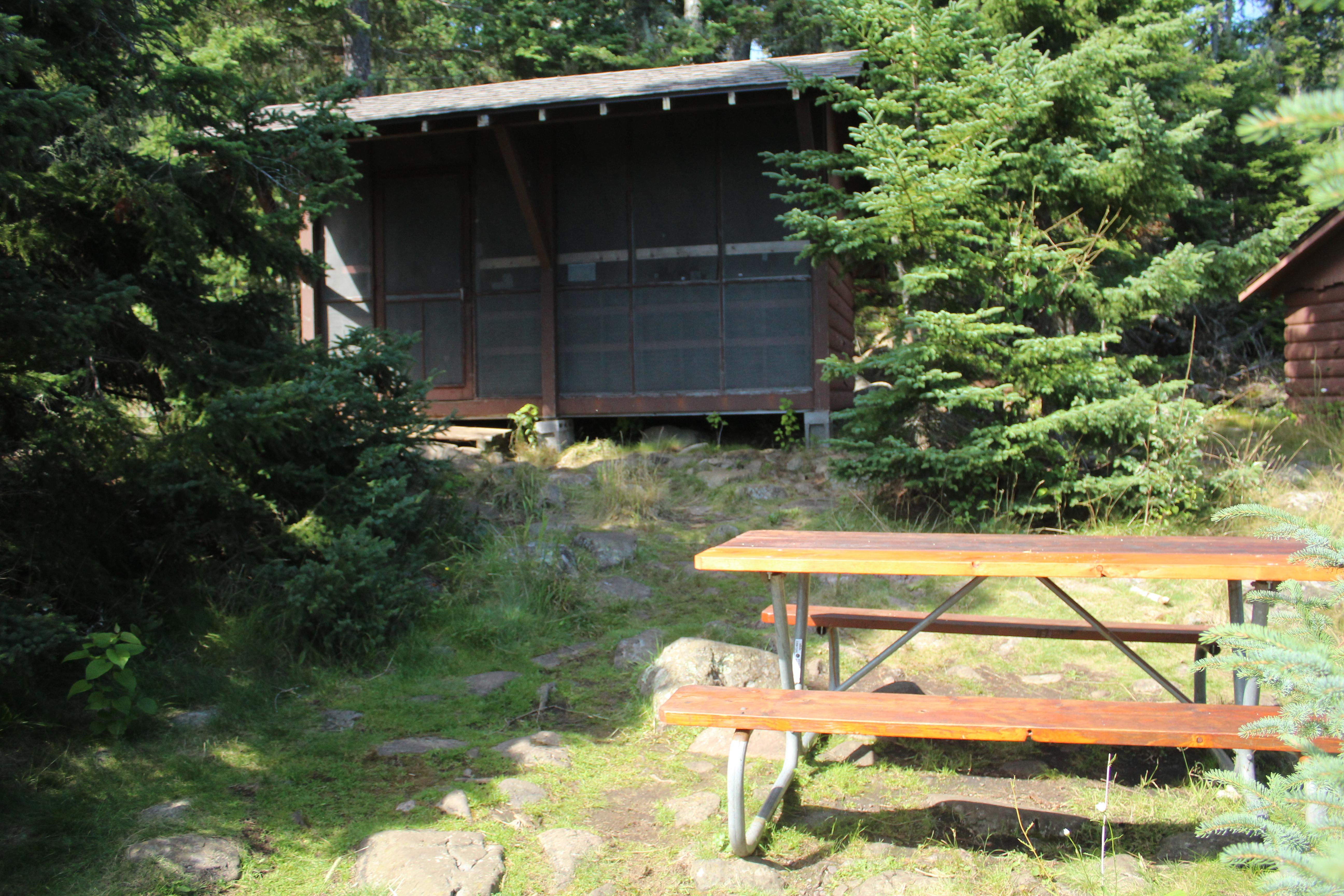 Campground shelter with picnic table.
