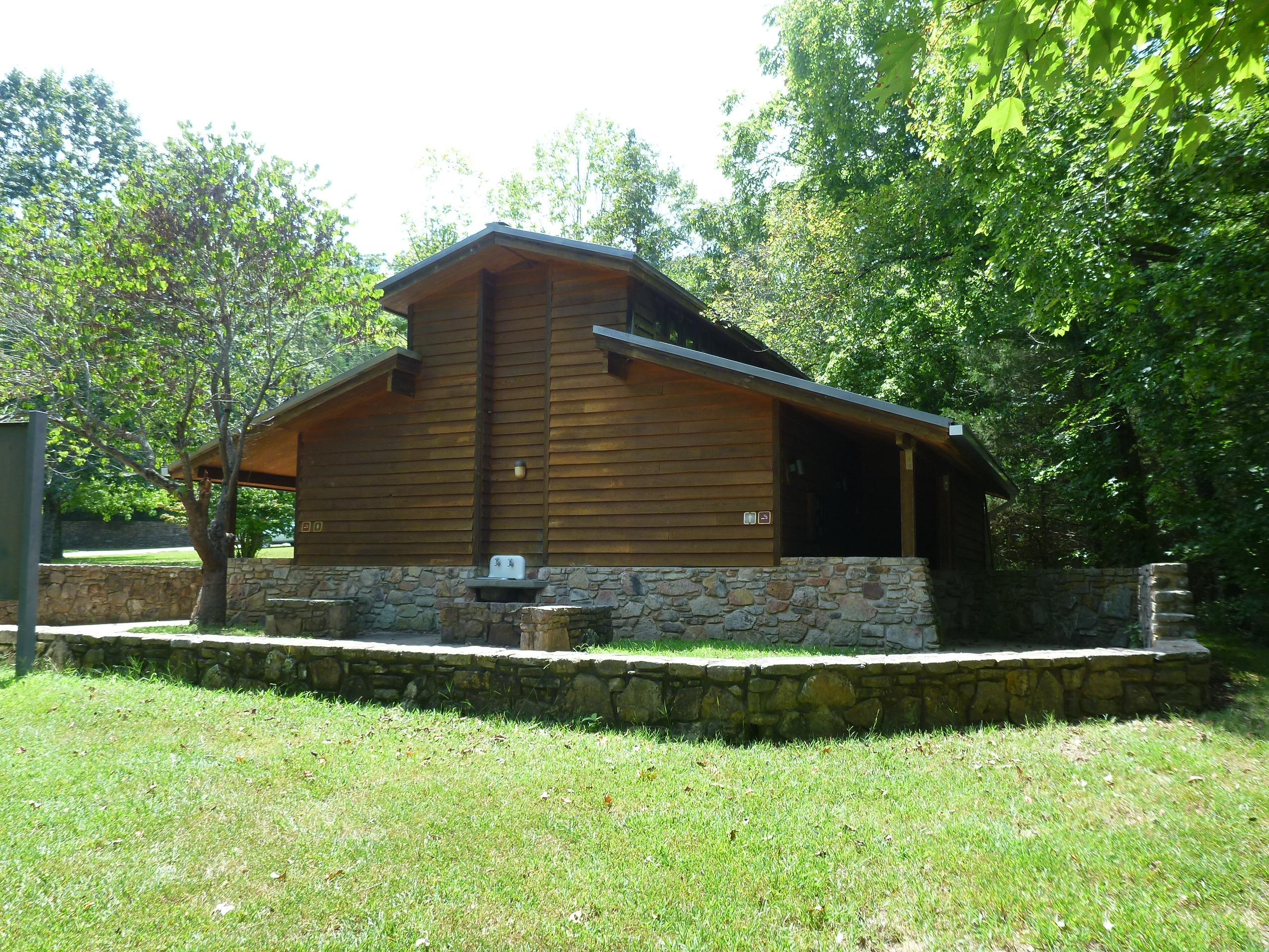 Wooden bathhouse structure in the Tyler Bend Campground.