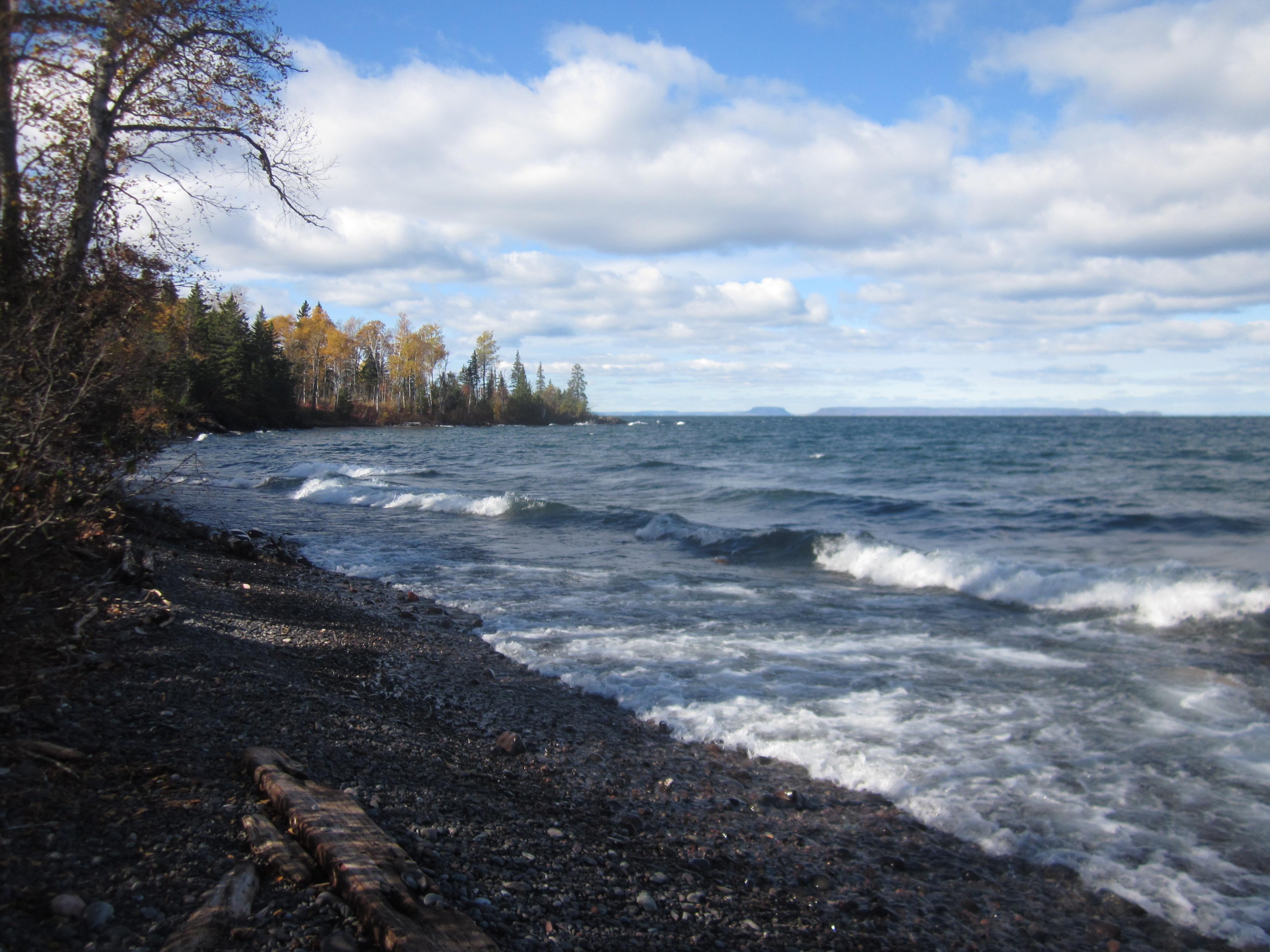 Lake Superior waves lapping the rocky shoreline of Little Todd Harbor.