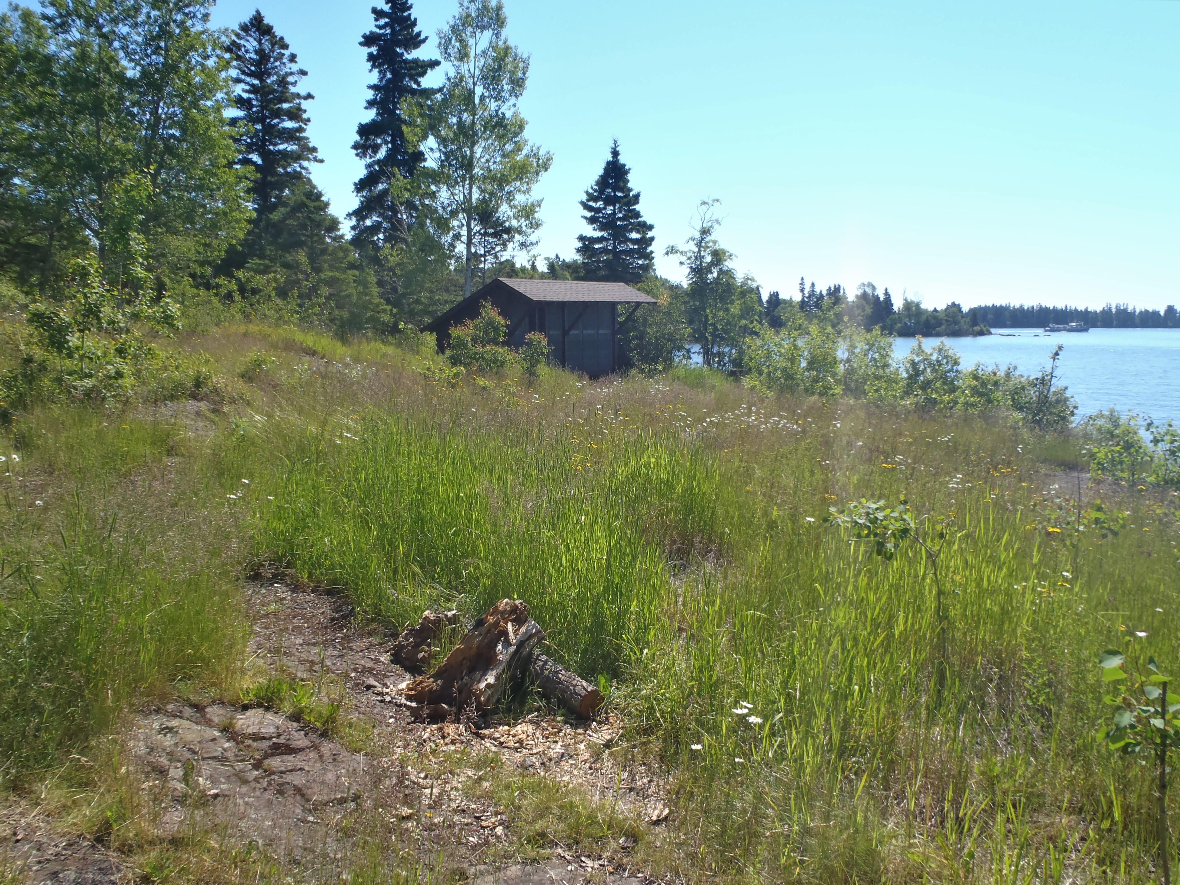 A shelter sits on the Lake Superior shoreline.