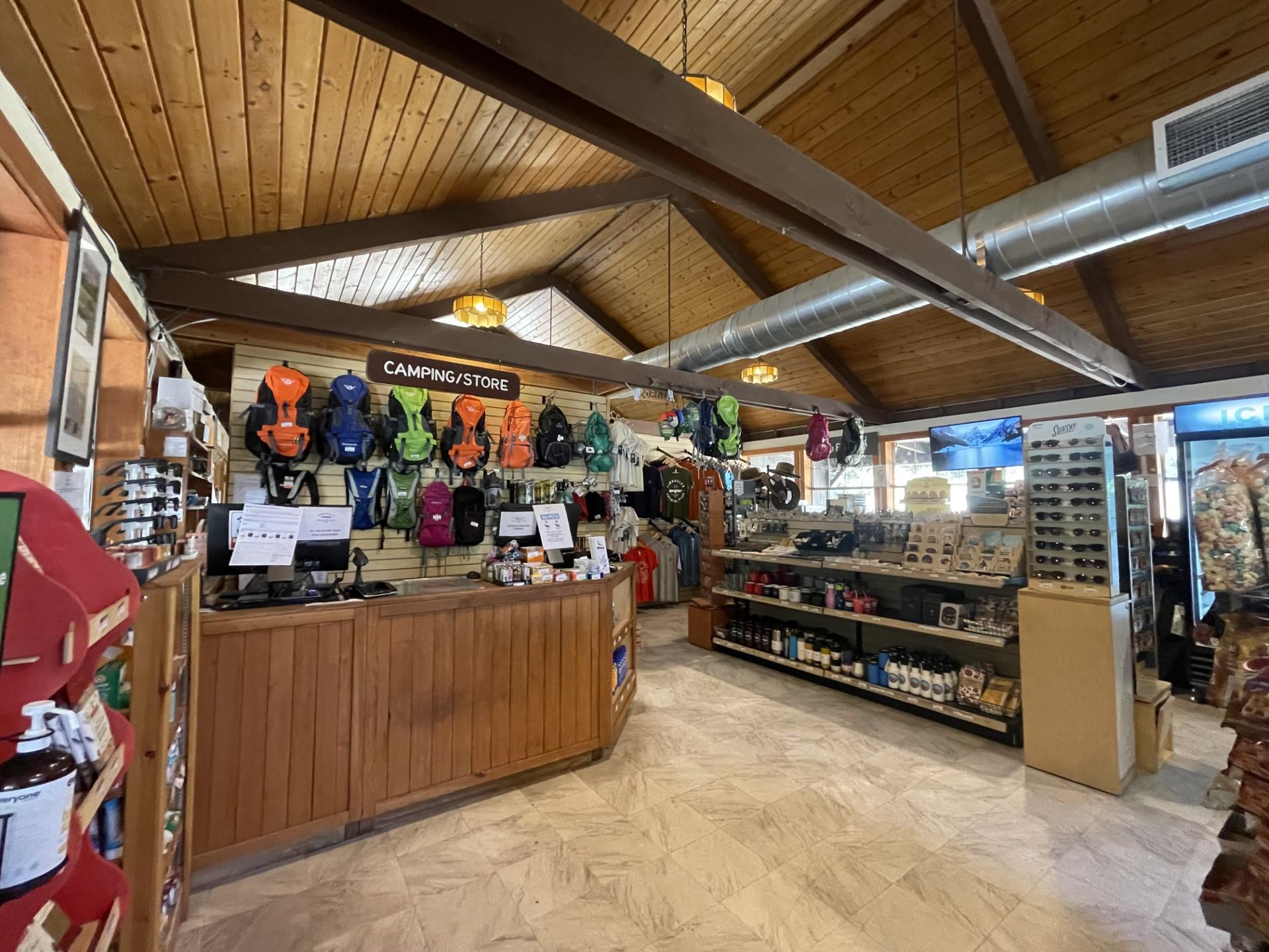 Front desk inside a campstore with miscellaneous merchandise on display