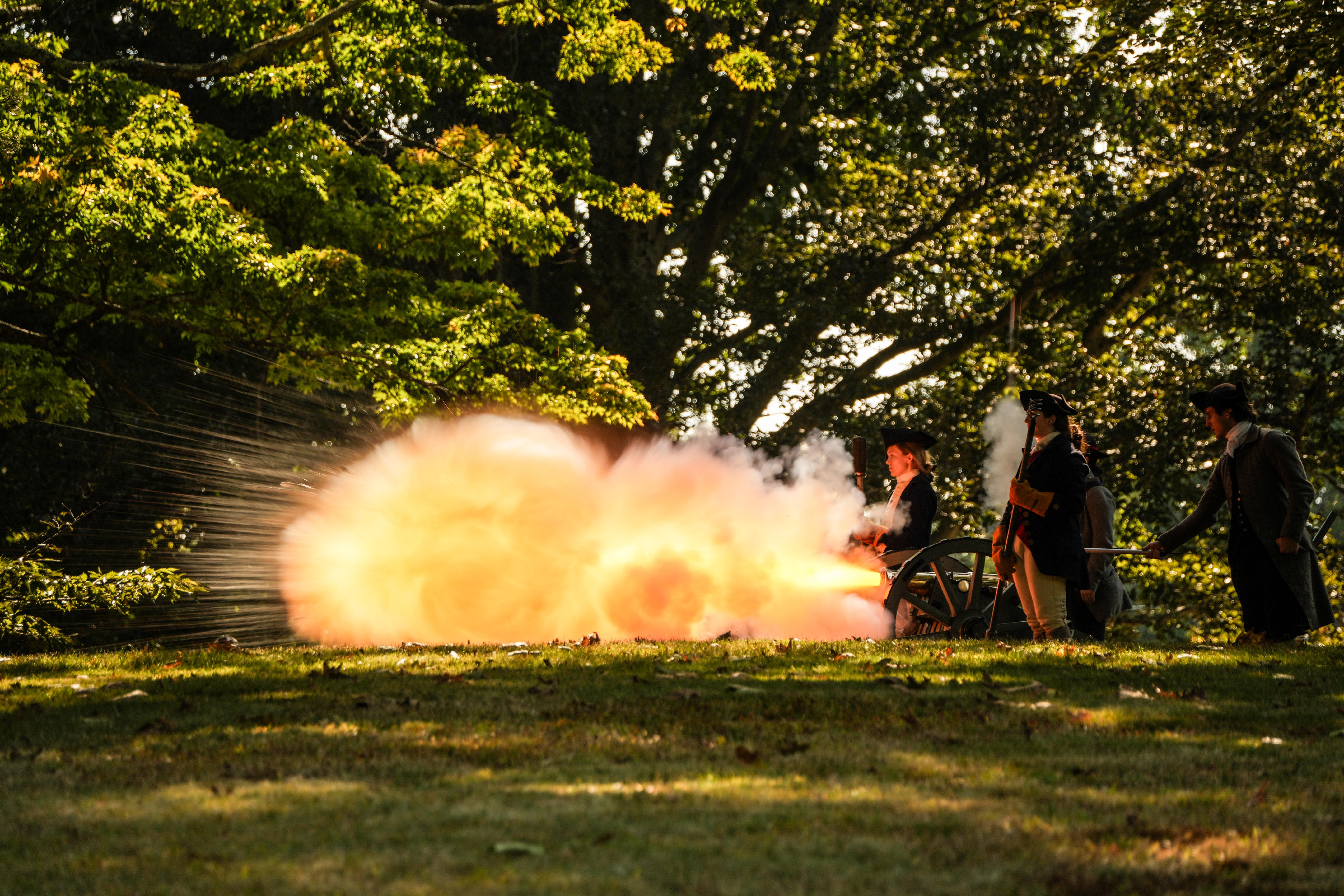 A small cannon fires a large blast of flame.