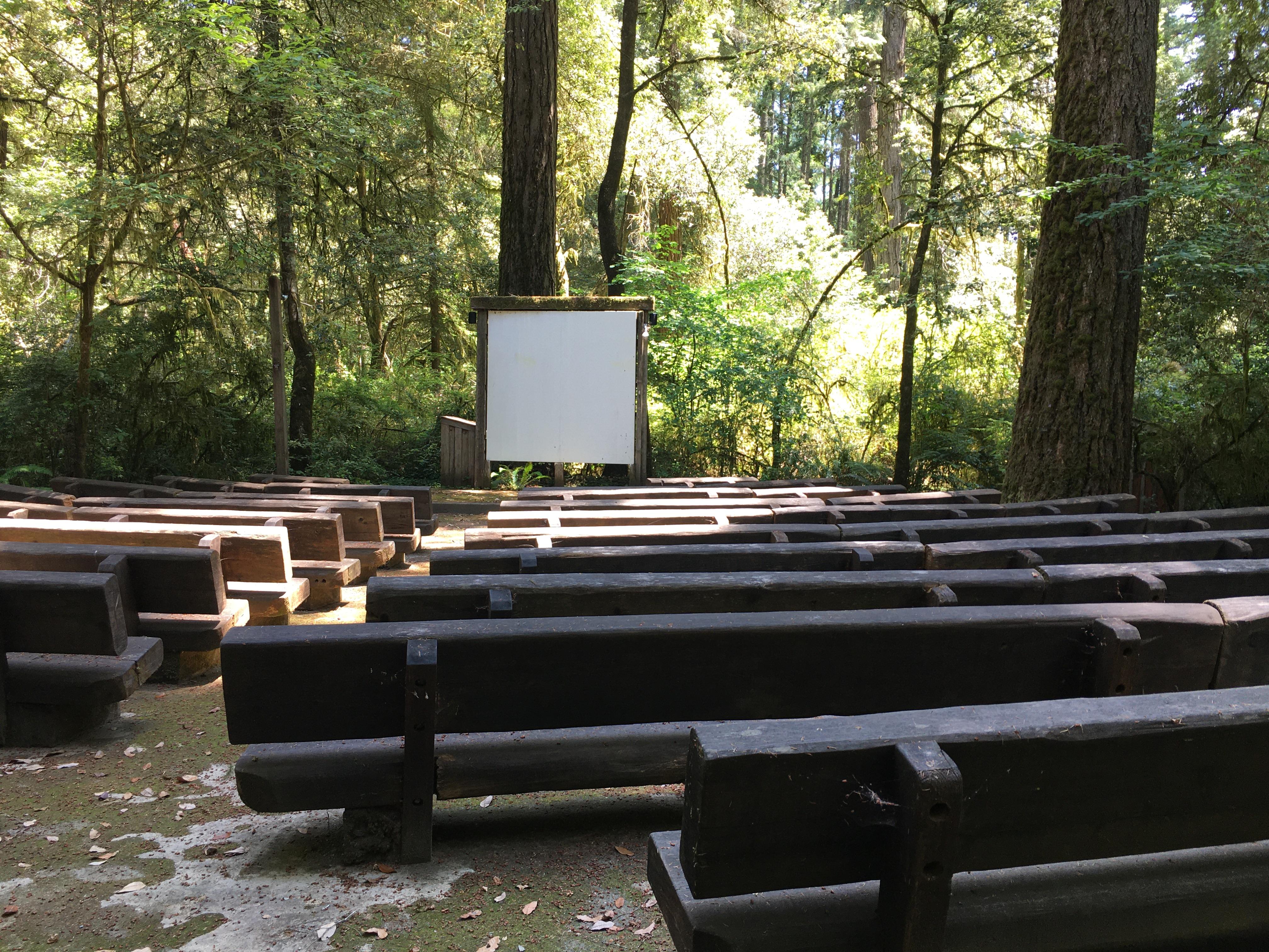 Wooden seats in front of a slideshow screen