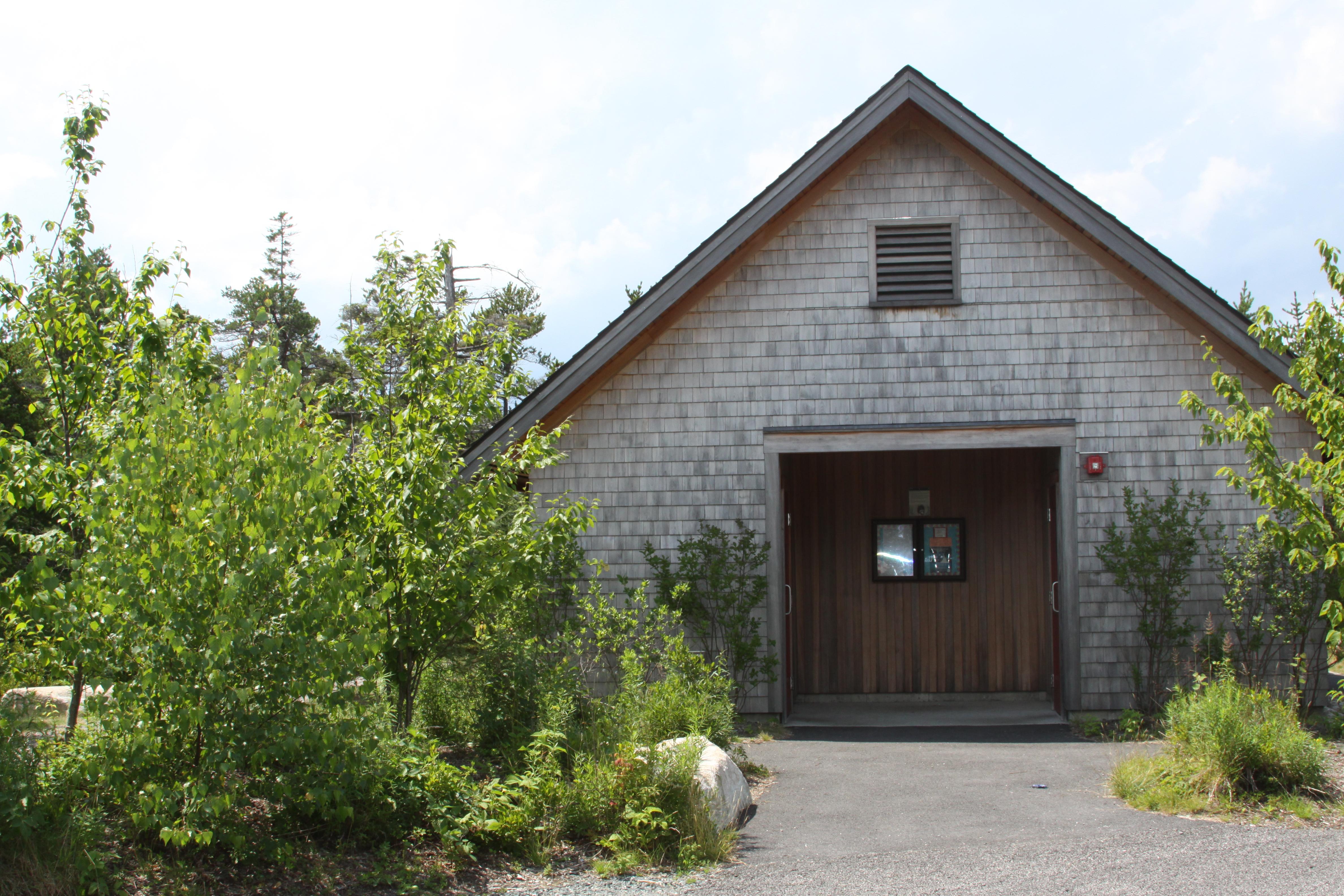 Grey and brown building with restroom facilities